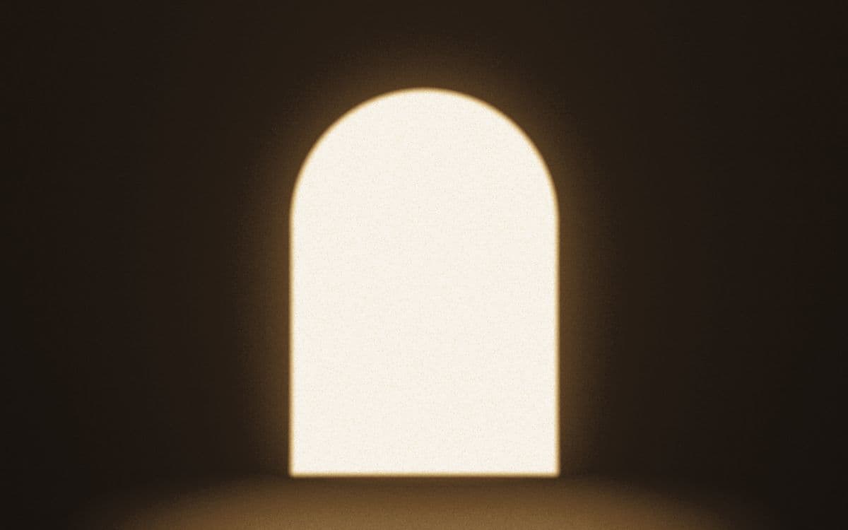 An arched opening filled with warm light.