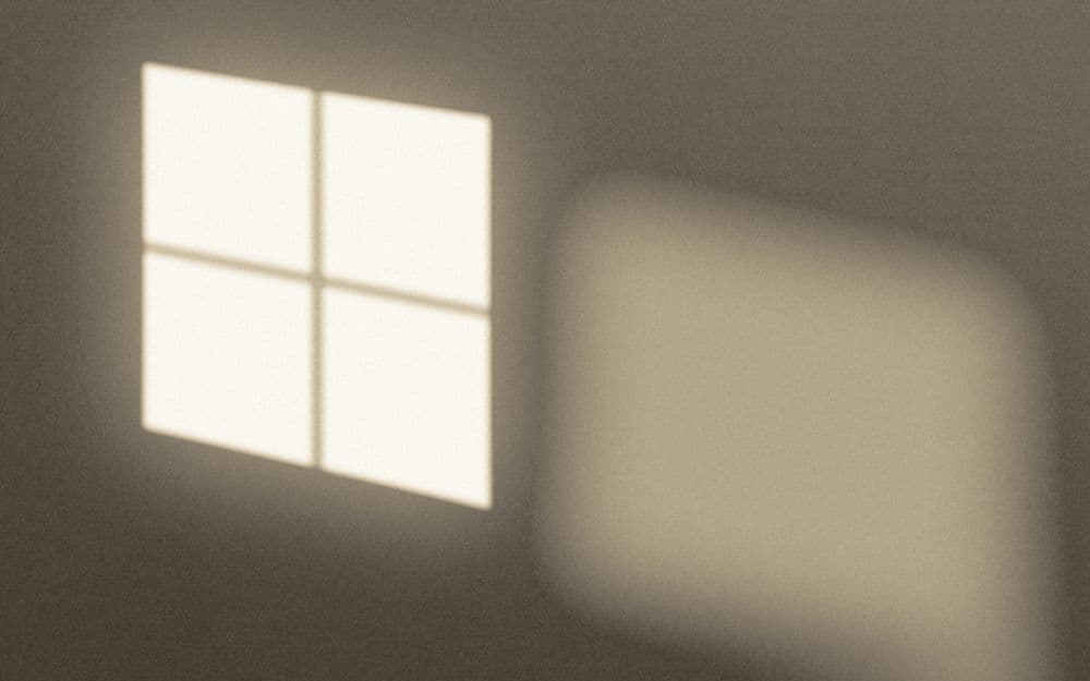 Morning light through a window falling across a pale wall.