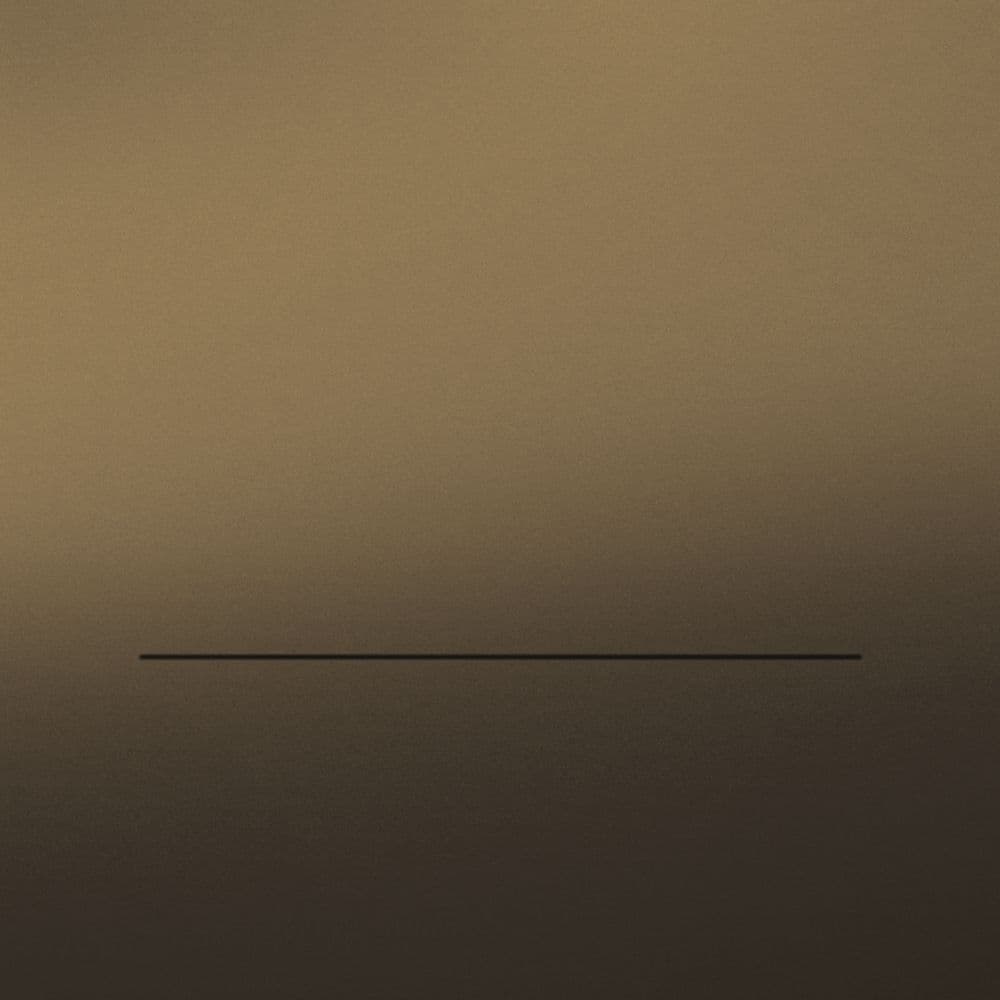 A dusk-toned sleeve with a slow band of light and a single rule.