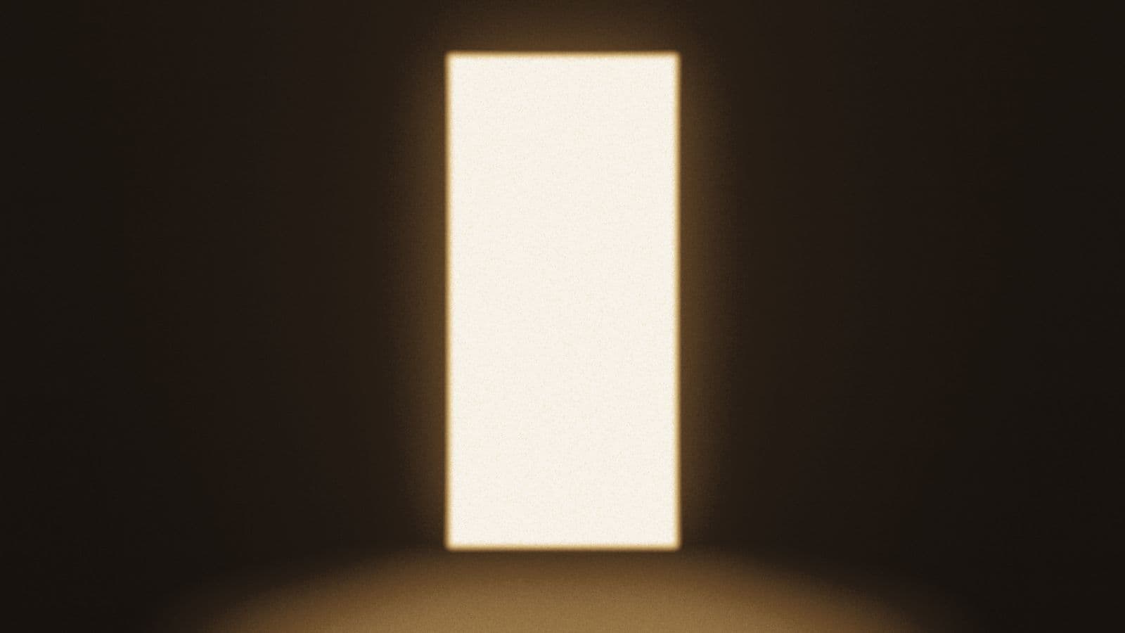 A doorway filled with warm light in a dark room.